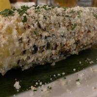 El Maiz · Grilled Mexican corn ,crema, cotija cheese and fresh cilantro