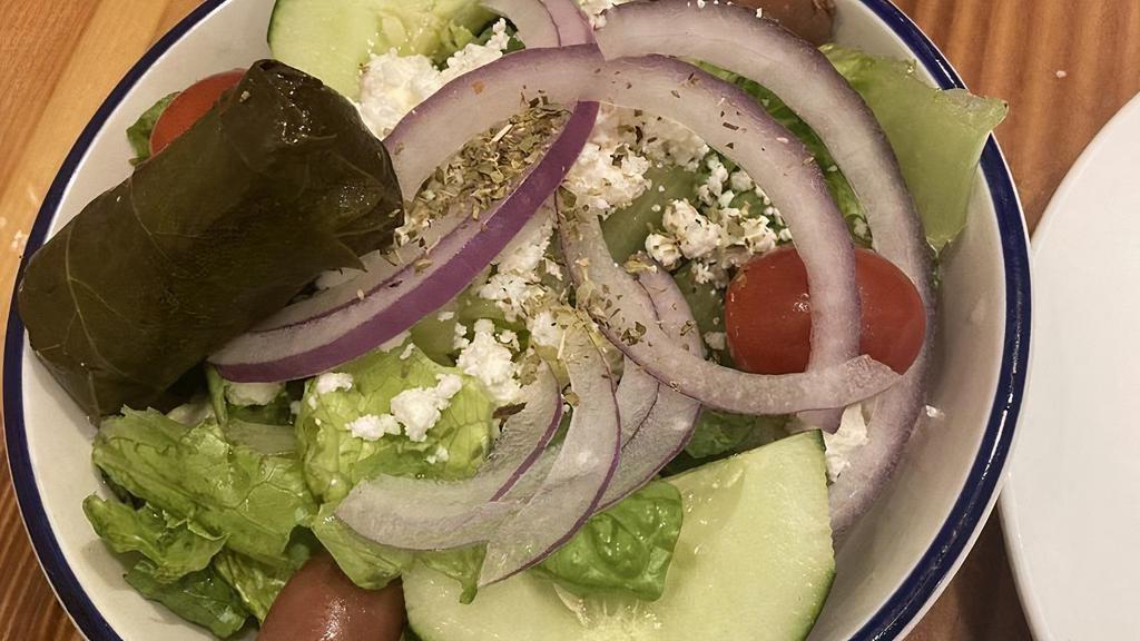 Greek · Gluten-Free. Classic Greek salad with lettuce, tomatoes, cucumbers, olives, red onions, feta cheese & dolmades served with house dressing.