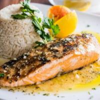 Atlantic Salmon · Topped with a lemon herb sauce &
served with rice.