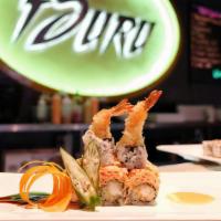 Dancing Dragon Roll · Shrimp tempura and avocado topped with spicy kani and king crab with yuzu miso and eel sauce.