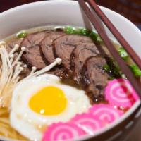Beef Ramen · Beef, egg, and vegetable in miso or soy broth. Served with salad. Choice of miso paste or so...