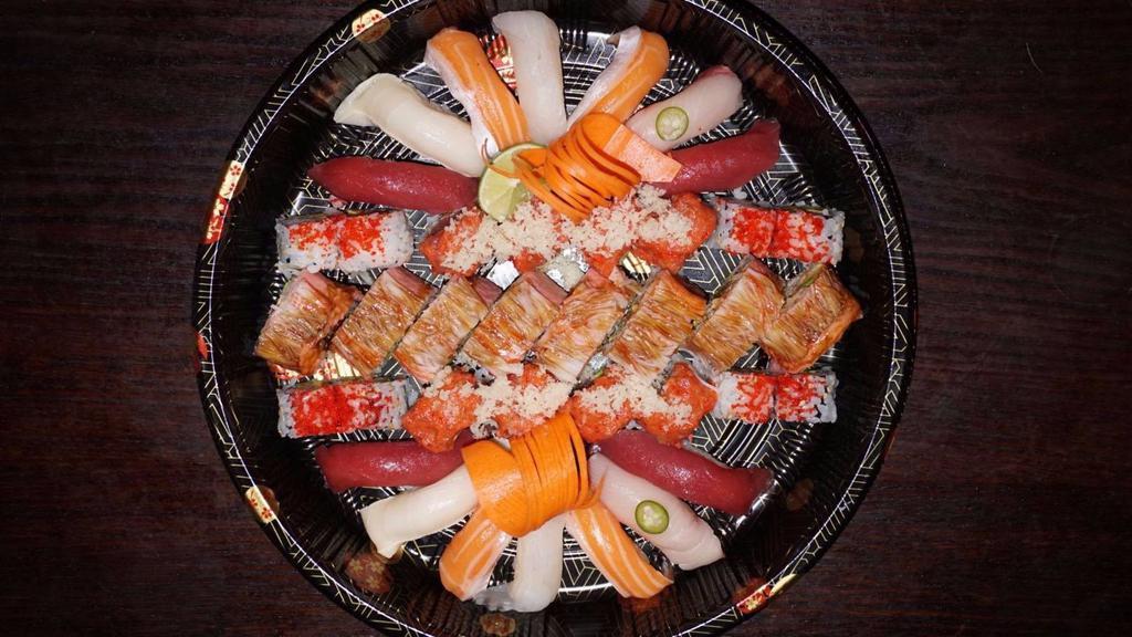 Sushi Bar Party Tray C · Red dragon roll, spicy girl roll, California roll, and 14 pieces sushi. Served with salad or soup.