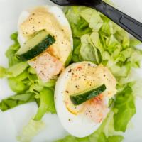 Lobster Deviled Eggs · Lobster, cucumber, and truffle oil.
