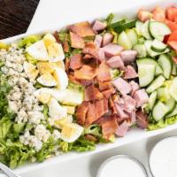 Cobb Salad · Organic Mixed Greens, Vine Ripened Tomato, Onion , Think-cut Bacon, Green Onions, Hard Boile...