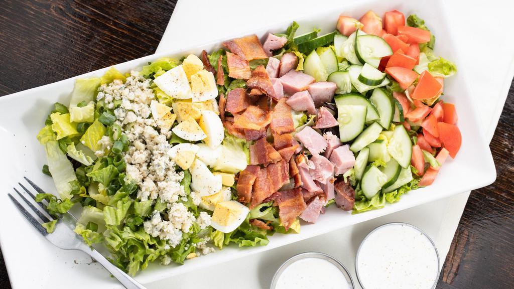 Cobb Salad · Organic Mixed Greens, Vine Ripened Tomato, Onion , Think-cut Bacon, Green Onions, Hard Boiled Egg Whites, Mozzarella Cheese, Grilled Butter Milk Chicken and Ranch Dressing