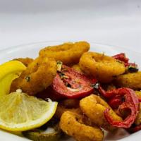 Spicy Fried Calamari · Spicy. Tossed with hot peppers and garlic butter.