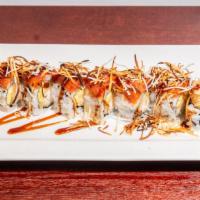Coconut Shrimp Roll · Coconut shrimp tempura and mango topped with spicy tuna and eel sauce wasabi sauce and cocon...