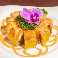 Tokyo Roll · Spicy tuna shrimp, avocado and tempura flakes topped with salmon and spicy mayo wrapped in s...
