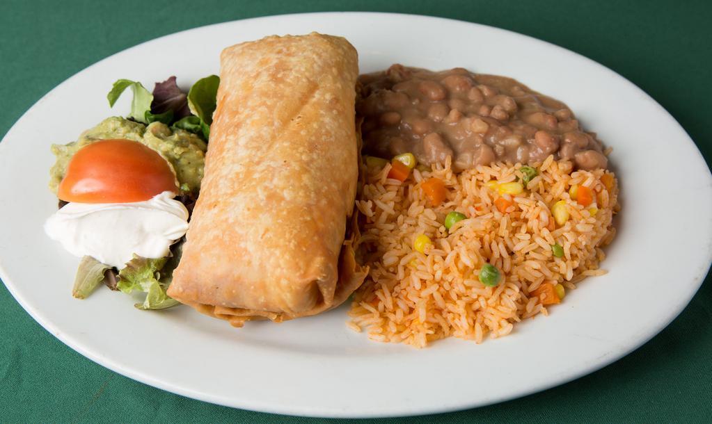 Chimichanga · A giant flour tortilla deep fried & filled with cheese & stuffed with shredded chicken or beef. Served with guacamole & sour cream.