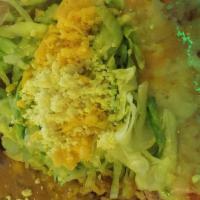 Enchiladas Suizas · Shredded chicken, beef, or cheese wrapped in two soft corn tortillas, topped with green sals...