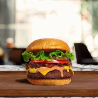 Classic Play Burger · American beef patty topped with lettuce, tomato, onion, and pickles.