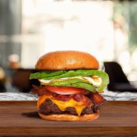 Morning Chomp Burger  · American beef patty topped with bacon, fried egg, avocado, melted cheese, lettuce, tomato, o...