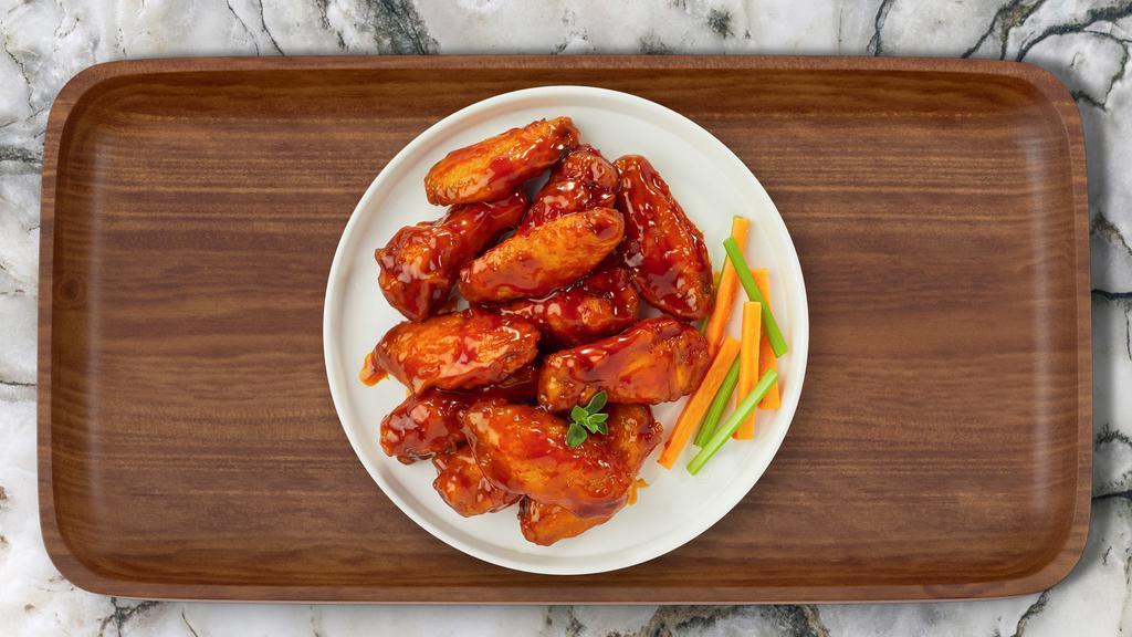 Buffalo Chicken Wings · Ten pieces of fresh chicken wings breaded, fried until golden brown, and tossed in buffalo sauce. Served with a side of celery, carrots, bleu cheese, and your choice of sauce.