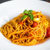 Spaghetti Al Pomodoro · San Marzano tomatoes, basil, garlic