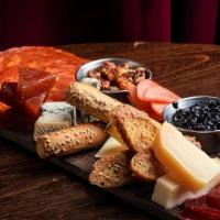 Cheese & Charcuterie Board · Hot Capicola, Beef Salami, Aged White Cheddar, Brie,Blue Cheese Stuffed Dates, Toasted Bread...