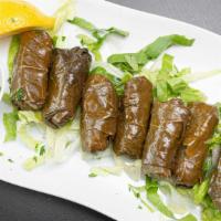 Dolmades · Grape leaves stuffed with rice.
