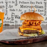 The Kimbell · Beef patty topped with iceberg lettuce, tomatoes, waffle fries, mozzarella sticks, melted Am...