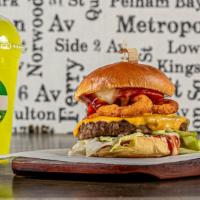 Uk Cheese · Beef patty topped with iceberg lettuce, onion rings, tomatoes, cheddar cheese,  pepperjack, ...