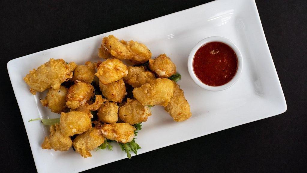 -Fried Cheese Curds · Beer-battered Ellsworth cheese curds fried and served with spicy pepper jam.