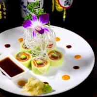 Naruto Roll · Belly tuna, salmon, yellowtail, avocado and caviar rolled with cucumber wrap.