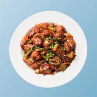 Chicken Manchurian Madness · Chicken morsels, seasoned, batter fried and sauteed with green onions and an Indo-Chinese Ma...