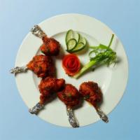Drums Of Heaven · Chicken drumsticks, seasoned and batter coated in a spicey chili batter and fried crisp
