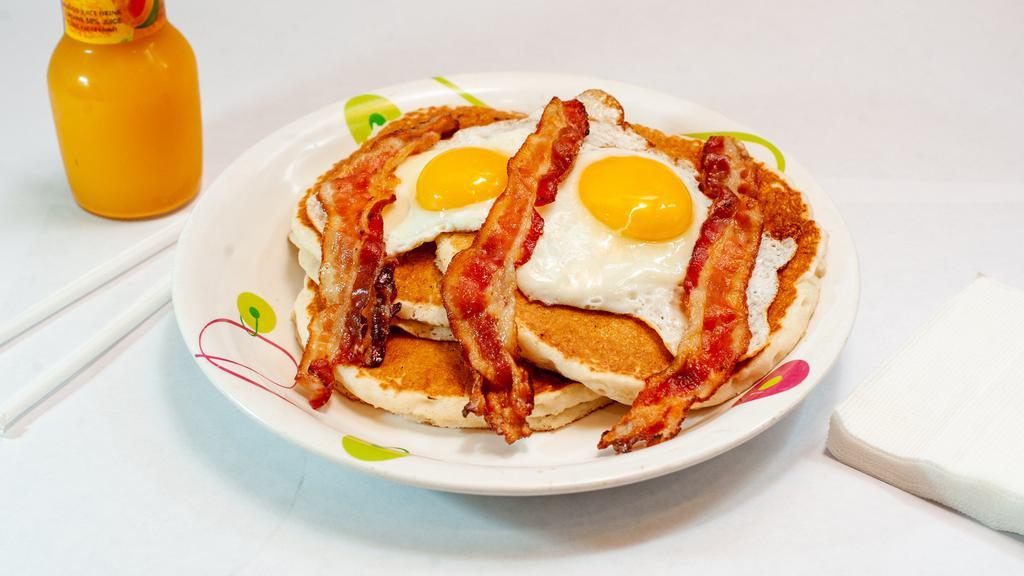 Pancakes Deluxe  With 2 Eggs, Bacon · 