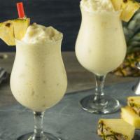 Piña Colada Smoothie · Classic piña colada flavors. Creamy smoothie blended with pineapple, banana and shredded coc...