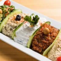 Mix Appetizers · A healthy portion of humus, ezme, tabuleh, babaganush and spinach tarator.