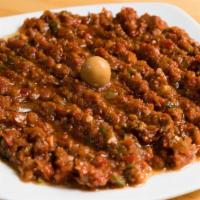 Ezme · A mixture of minced tomatoes, cucumber, hot spices, peppers, garlic, onions, walnut olive oi...