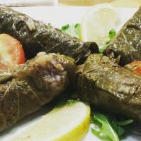 Stuffed Grape Leaves (4 Pc) · Hand rolled grape leaves stuffed with currant, onion, dill, parsley, rice and herbs.