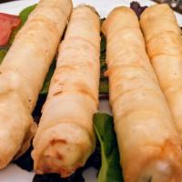 Sigara Boregi (4 Pc) · Pan-fried phyllo scrolls stuffed with feta cheese, dill and parsley.
