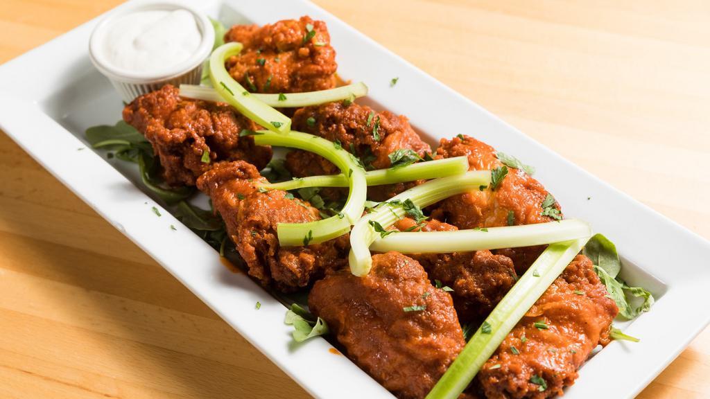Buffalo Wings (8 Pc) · Served with blue cheese and celery.