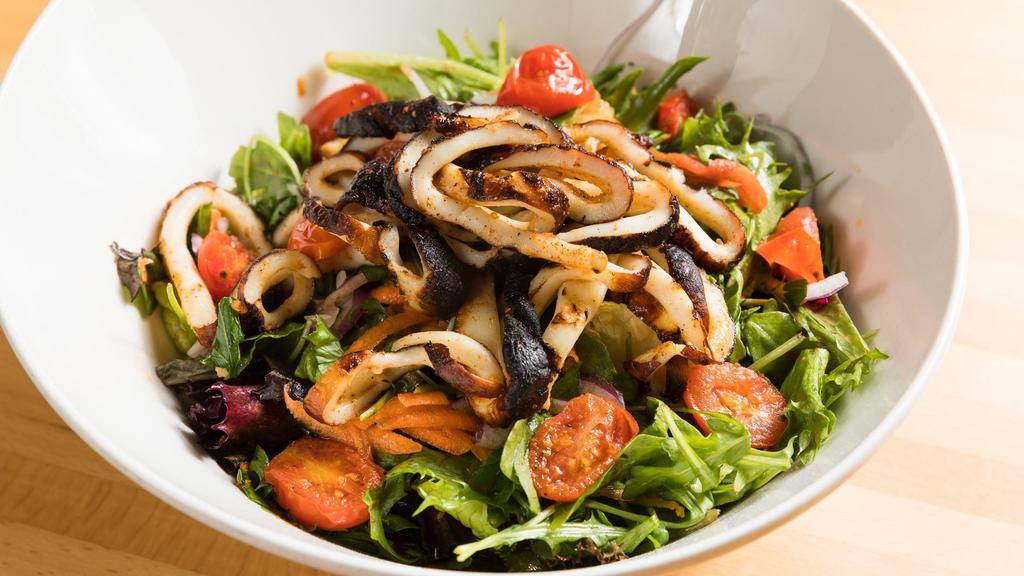 Calamari Salad · Char-grilled fresh calamari, tomato, red onions, parsley and mix green salad, tossed with olive oil and lemon juice.