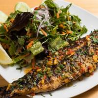 Char-Grilled Branzini · Exotic, tender and delicious white meat, served whole, char-grilled with mix green salad.