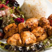Chicken Shish Kebab · Tender chunks of chicken marinated with chef's own blend and herbs served with salad and rice.