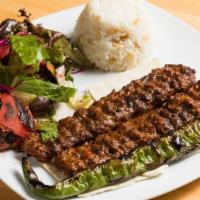 Lamb Adana Kebab · Ground lamb flavored with red bell peppers, slightly seasoned with paprika and grilled on sk...