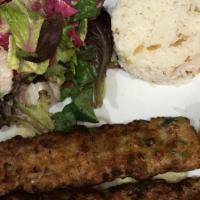Chicken Adana Kebab · Ground chicken flavored with red bell peppers, parsley and grilled on skewers served with sa...