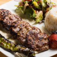 Izgara Kofte (Grilled Meatballs) · Ground lamb seasoned with onion, parsley and herbs char grilled served with rice and salad.