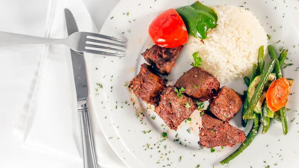 Beef Shish Kebab · Cubes of beef marinated in chef's special sauce and grill on skewers served with rice and salad.