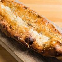 Kiymali Pide (Ground Lamb Pide) · A thick dough crust stuffed with seasoned ground lamb.