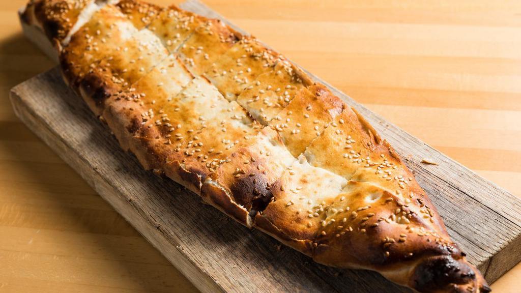 Kiymali Pide (Ground Lamb Pide) · A thick dough crust stuffed with seasoned ground lamb.