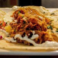 Street Tacos · Battered fish, sour cream drizzle, pickled onion, Kono's award-winning 12 hours slow roasted...