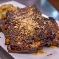 Full Rack Of Ribs · Full Rack of our famous dry rub marinaded ribs served with Asian slaw