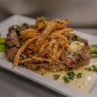 Prime New York · Marinated  New York strip, served with garlic Truffle butter, and a heaping amount of fried ...