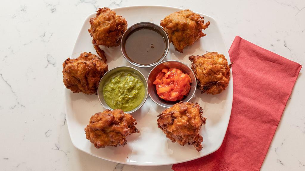Vegetable Pakora · Chopped mixed vegetables coated in batter and fried golden brown.