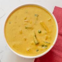 Vegetable Korma · Vegetables cooked in a creamy sauce with almonds and dried nuts.