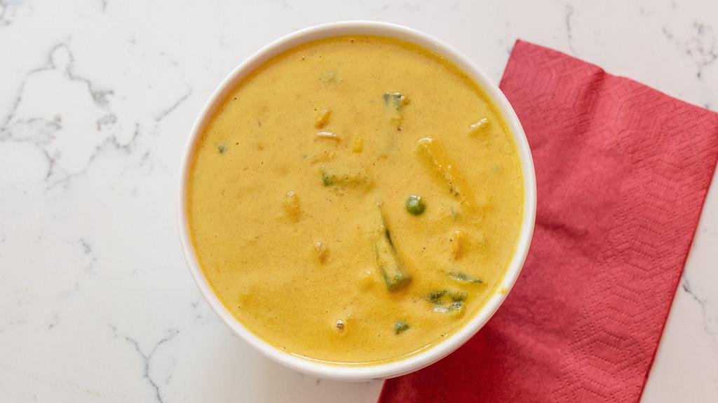 Vegetable Korma · Vegetables cooked in a creamy sauce with almonds and dried nuts.