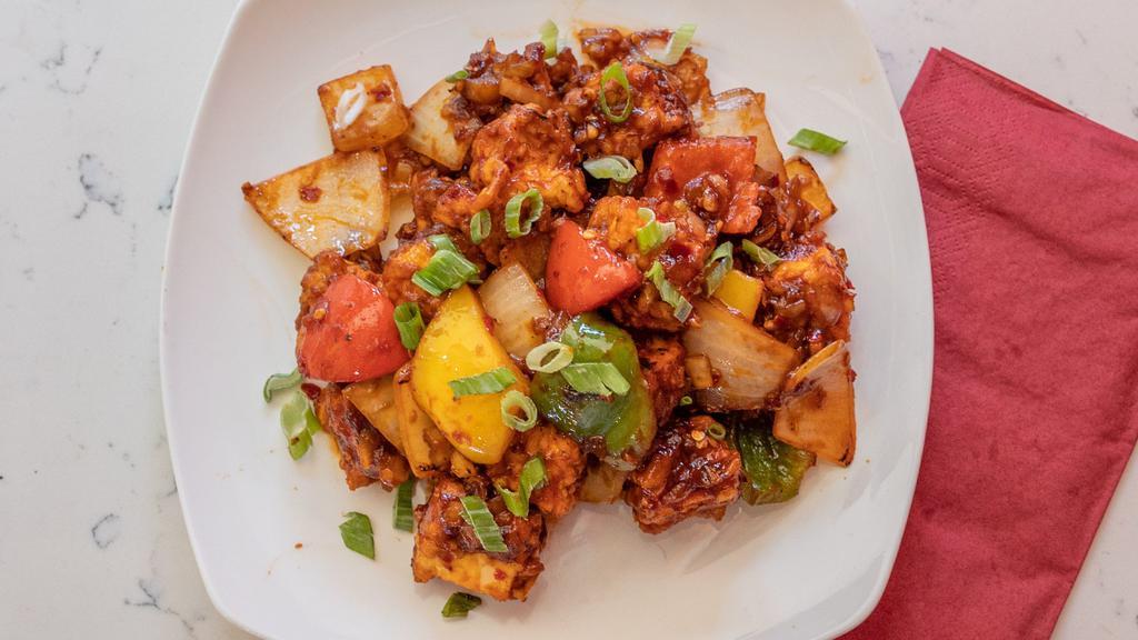Chili Paneer · Paneer cooked in a fiery chili sauce, onion, bell pepper and soy sauce.