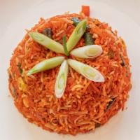 Vegetable Schezwan Fried Rice · Stir-fried rice mixed with vegetables seasoned with hot and spicy sauce bursting with ginger...